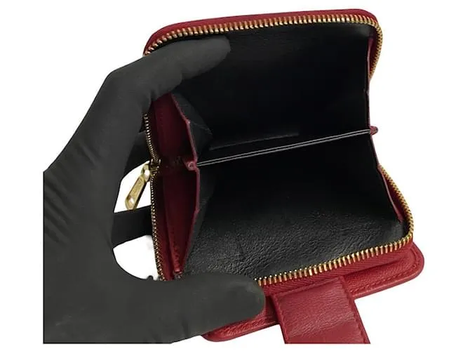 Cartera compacta de cuero con cremallera bifold de Yves Saint Laurent en muy buen estado 