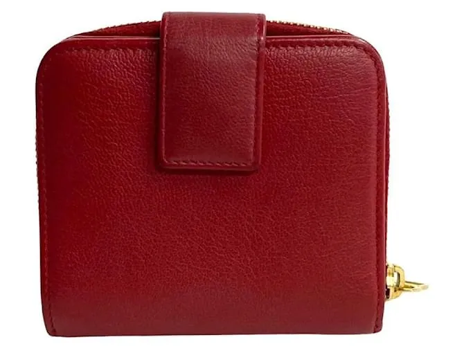 Cartera compacta de cuero con cremallera bifold de Yves Saint Laurent en muy buen estado 