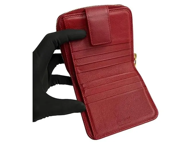 Cartera compacta de cuero con cremallera bifold de Yves Saint Laurent en muy buen estado 