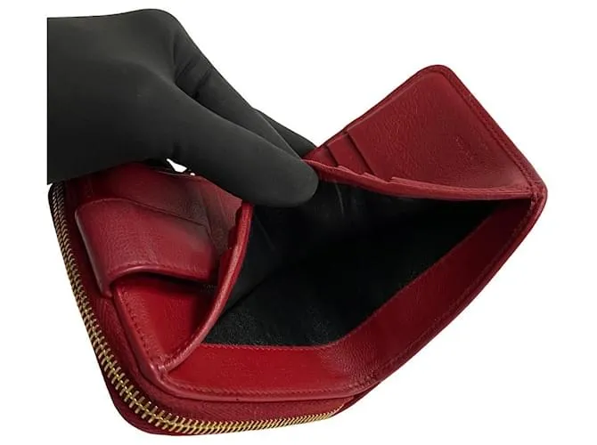 Cartera compacta de cuero con cremallera bifold de Yves Saint Laurent en muy buen estado 